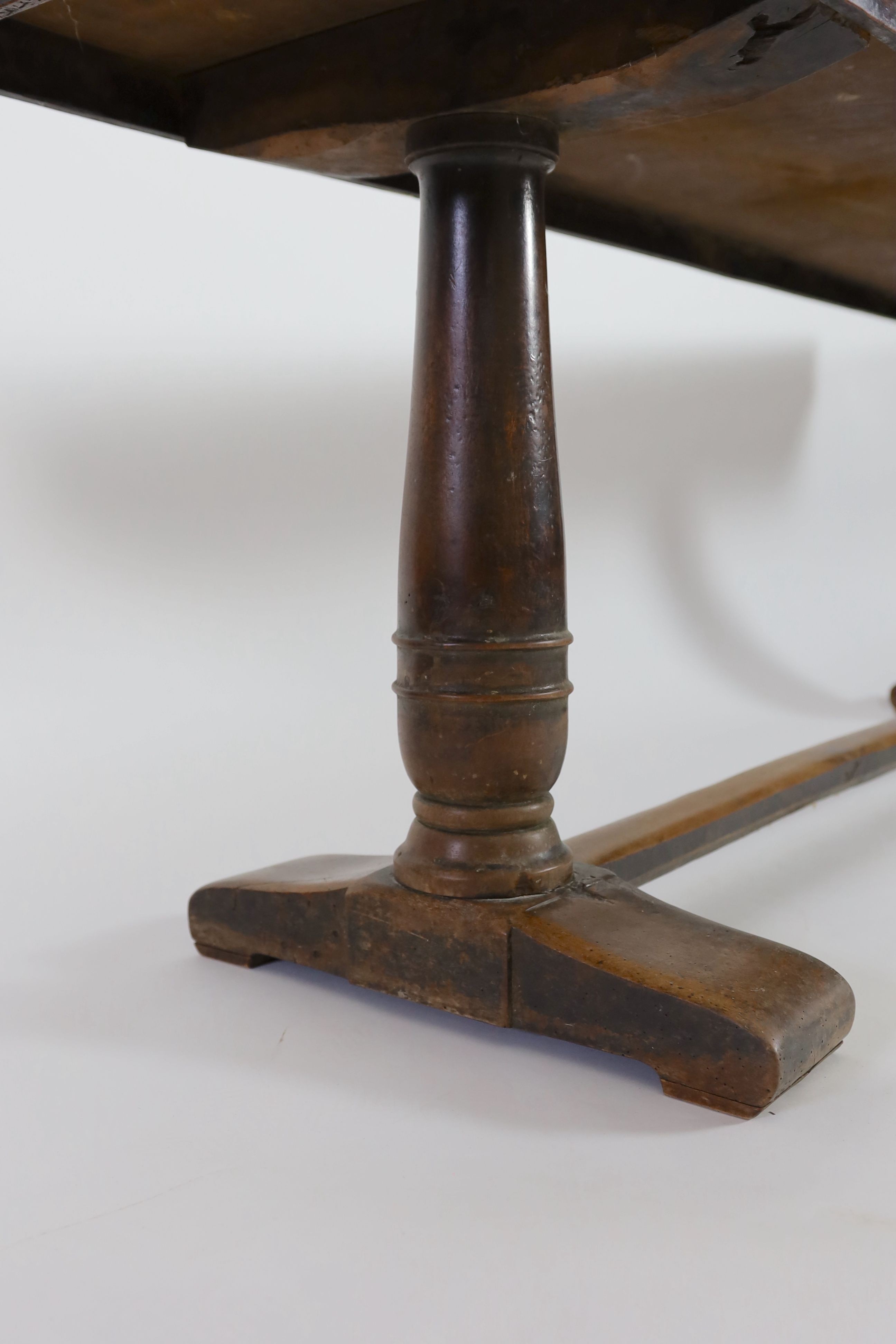 An 18th century walnut refectory table, W.232cm D.59cm H.82cm